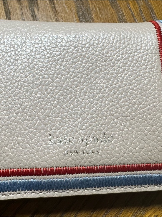 kate spade Handbags - kate spade White Pebbled Leather Wallet with Red & Blue Trim